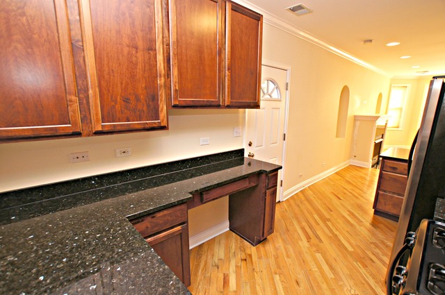 4110 North Keystone Avenue, Unit 3E Chicago, IL 60641 - Photo 13 of 21 a view of a room with wooden floor and chair