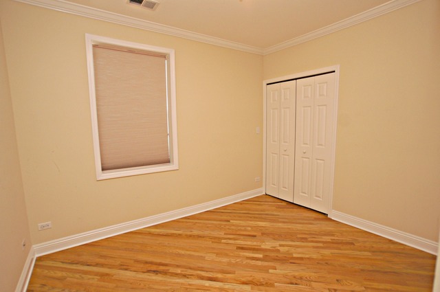 4110 North Keystone Avenue, Unit 3E Chicago, IL 60641 - Photo 17 of 21 a view of empty room with wooden floor