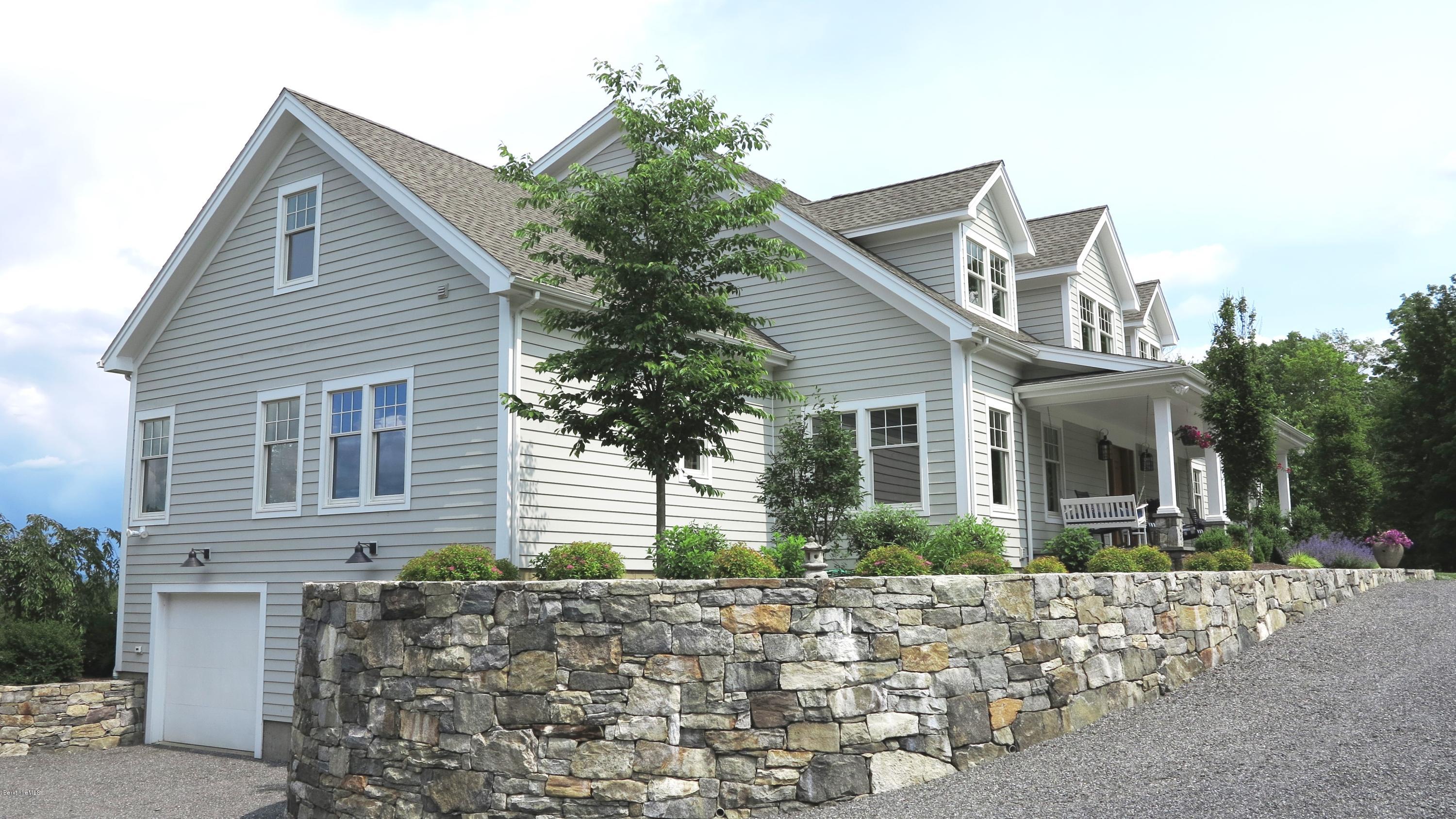 32 Oxbow Road Egremont, MA 01230 - Photo 2 of 35 a front view of a house with garden