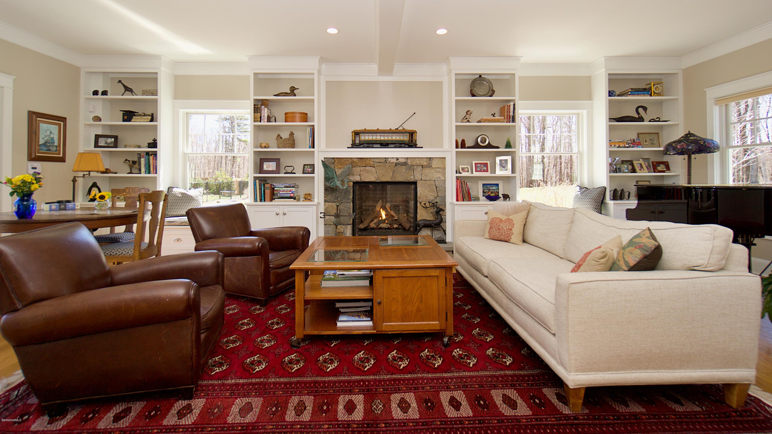 32 Oxbow Road Egremont, MA 01230 - Photo 11 of 35 a living room with furniture and a fireplace