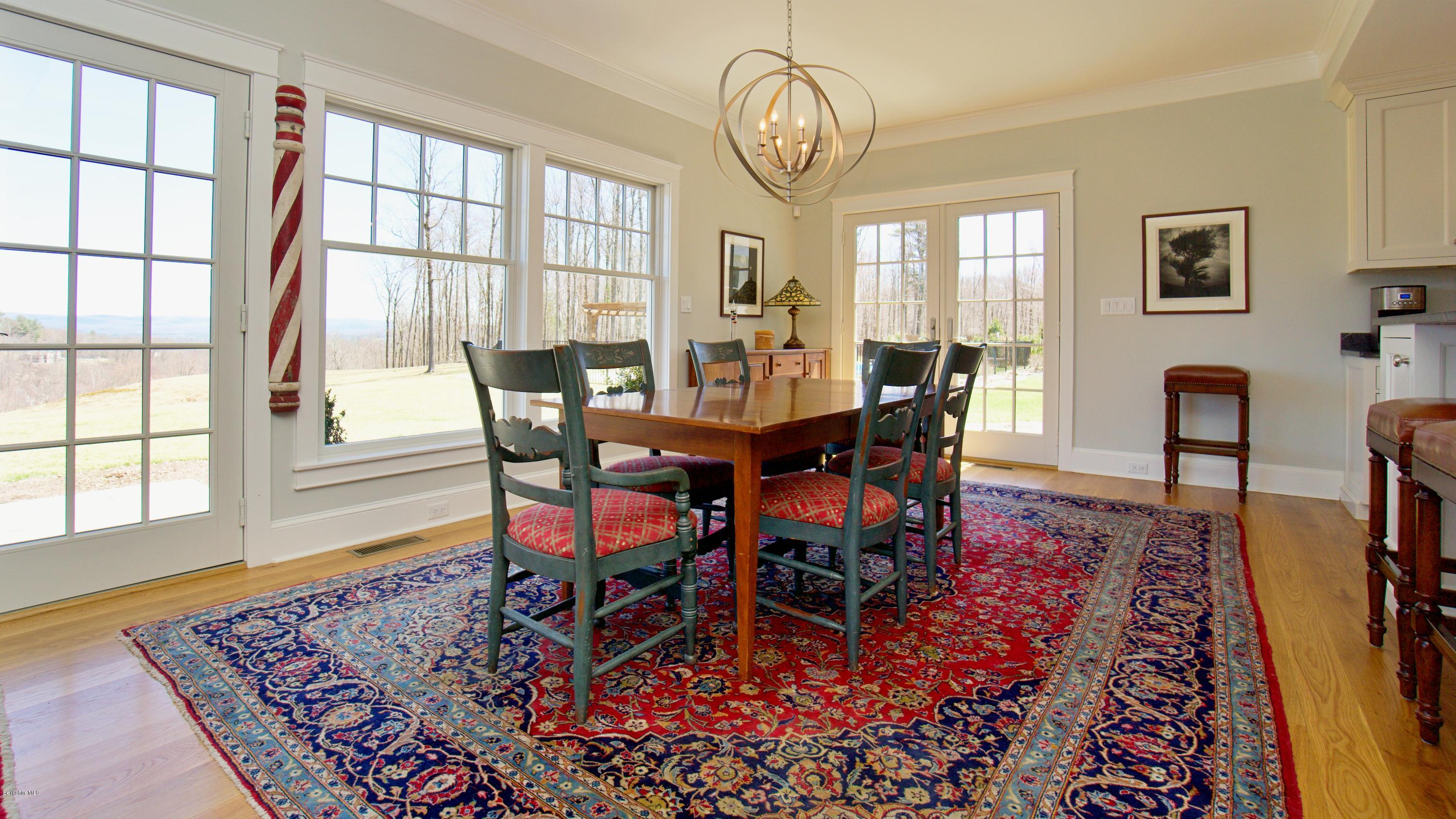 32 Oxbow Road Egremont, MA 01230 - Photo 12 of 35 a view of a dining room with furniture window and wooden floor