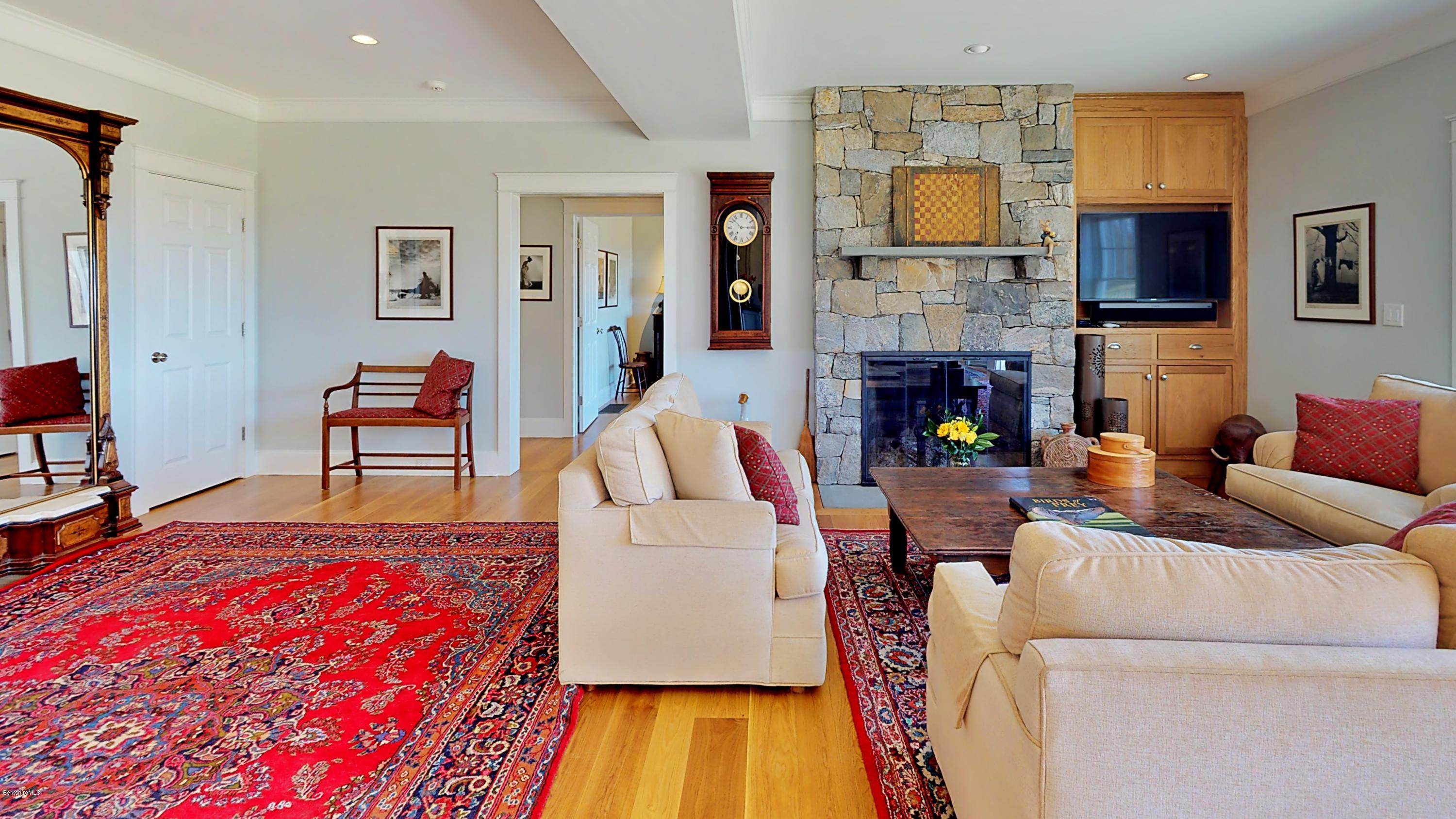 32 Oxbow Road Egremont, MA 01230 - Photo 19 of 35 a living room with furniture and a fireplace