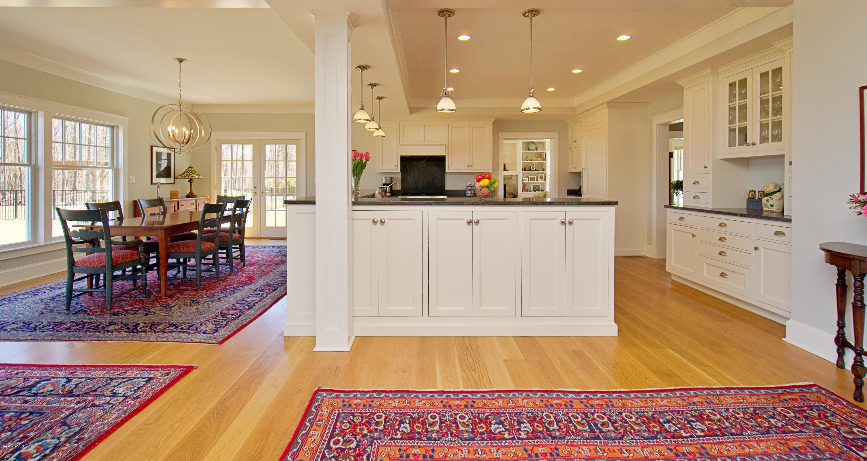 32 Oxbow Road Egremont, MA 01230 - Photo 23 of 35 a large dining hall with stainless steel appliances granite countertop a couch and stove