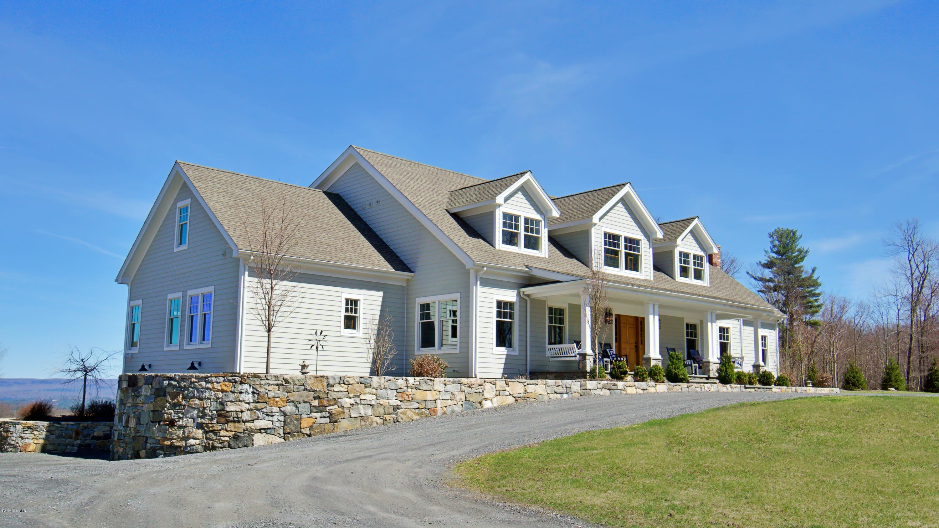 32 Oxbow Road Egremont, MA 01230 - Photo 30 of 35 a front view of a house with a yard