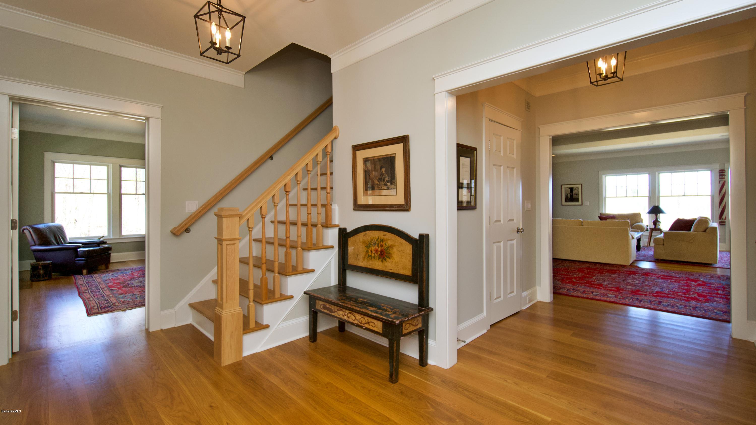 32 Oxbow Road Egremont, MA 01230 - Photo 6 of 35 a view of an entryway with wooden floor and a livingroom