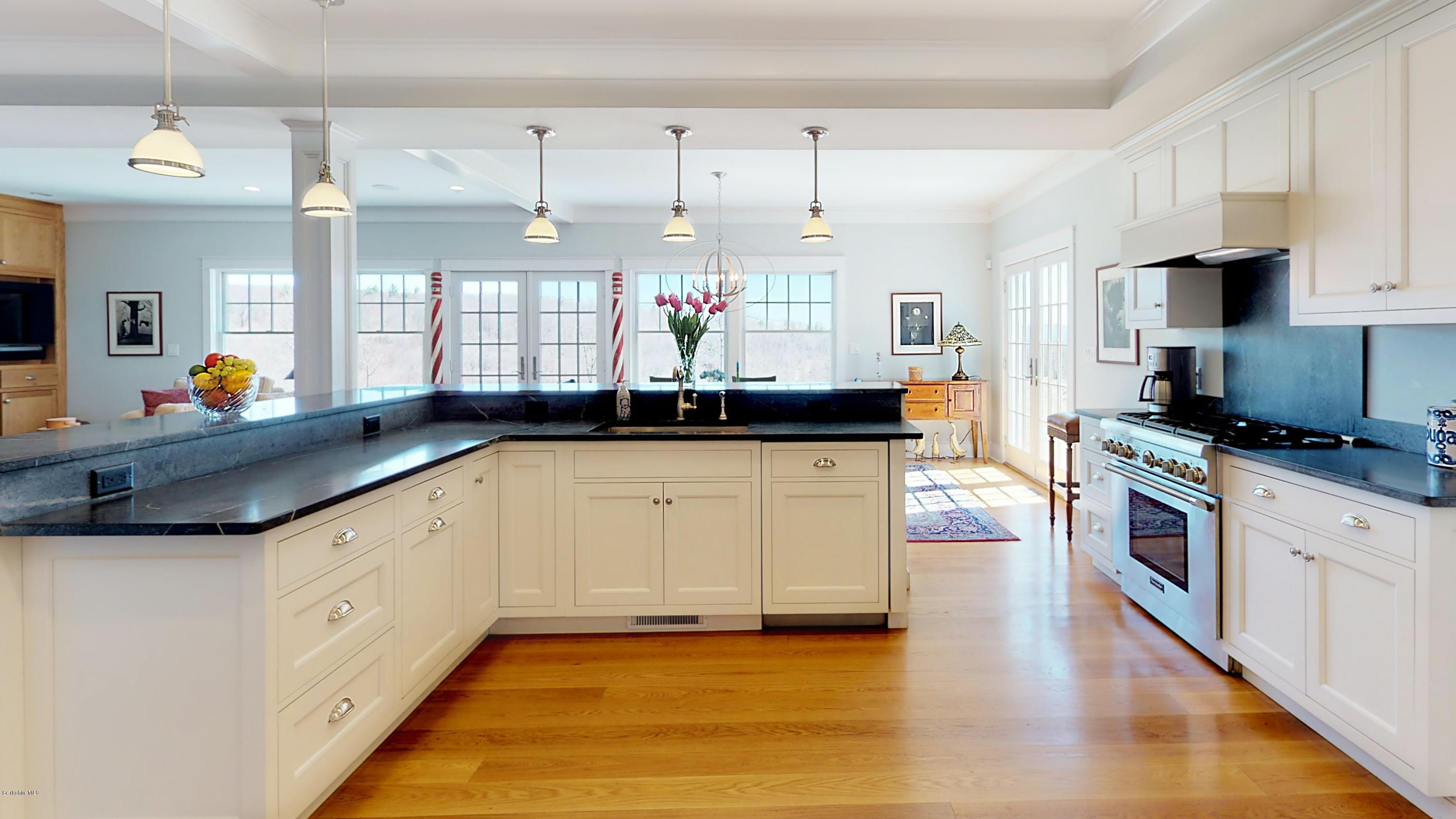 32 Oxbow Road Egremont, MA 01230 - Photo 8 of 35 a kitchen with granite countertop a sink a stove and cabinets