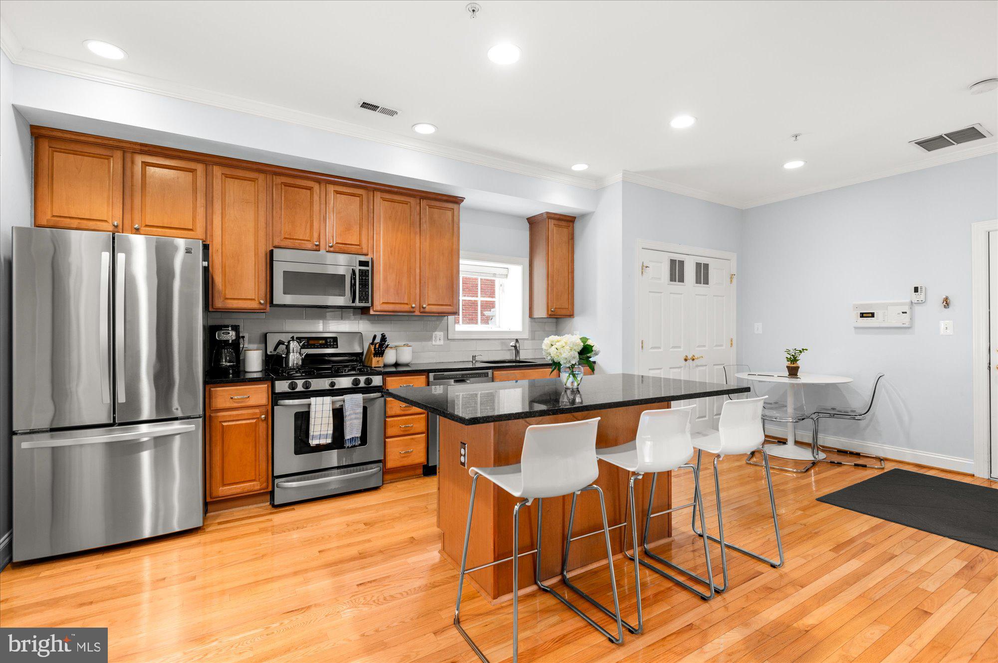 425 M Street Northwest, Unit F Washington, DC 20001 - Photo 2 of 24 Gorgeous open kitchen with island and seating!