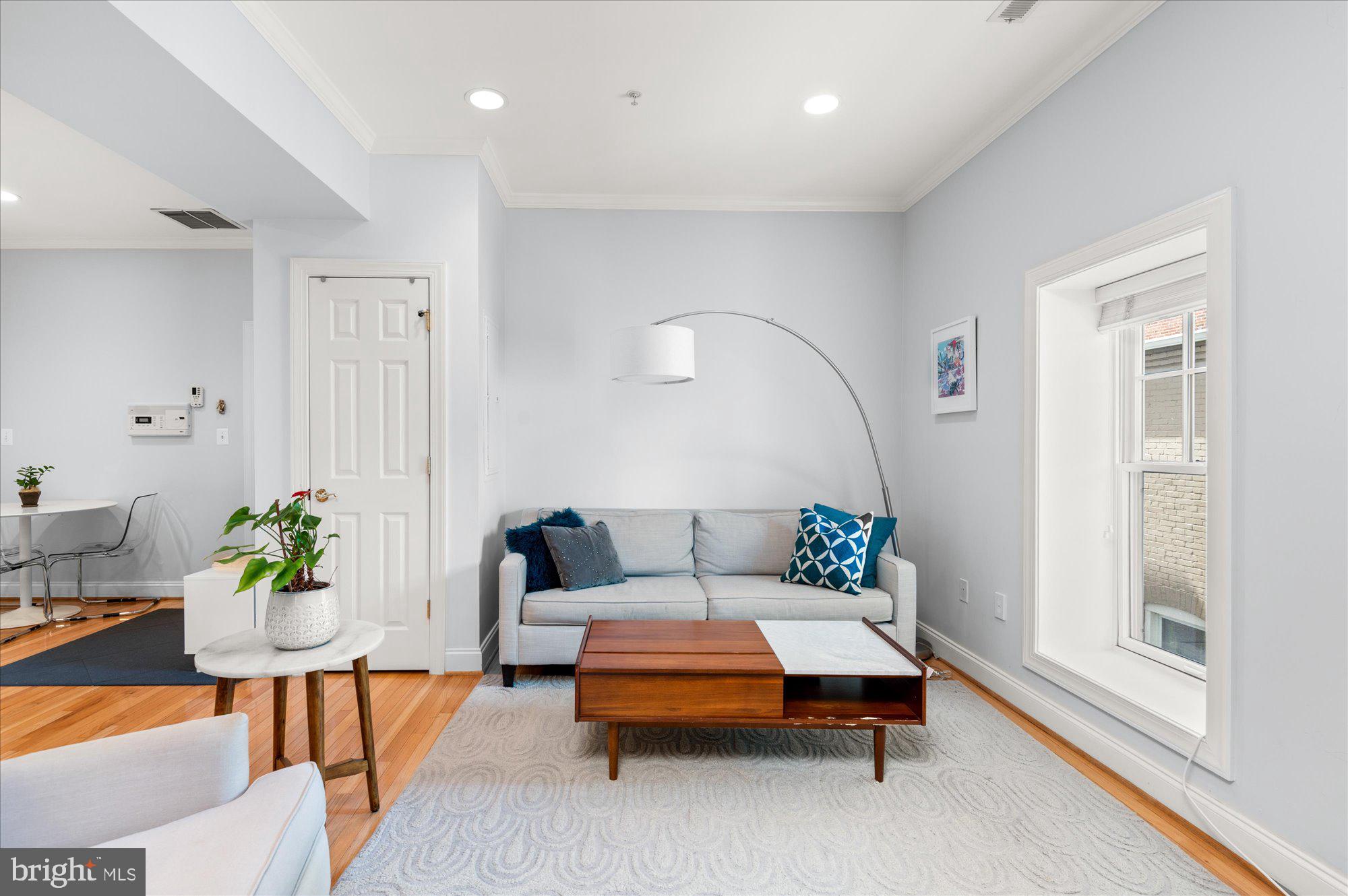 425 M Street Northwest, Unit F Washington, DC 20001 - Photo 6 of 24 Family Room with western sunlight