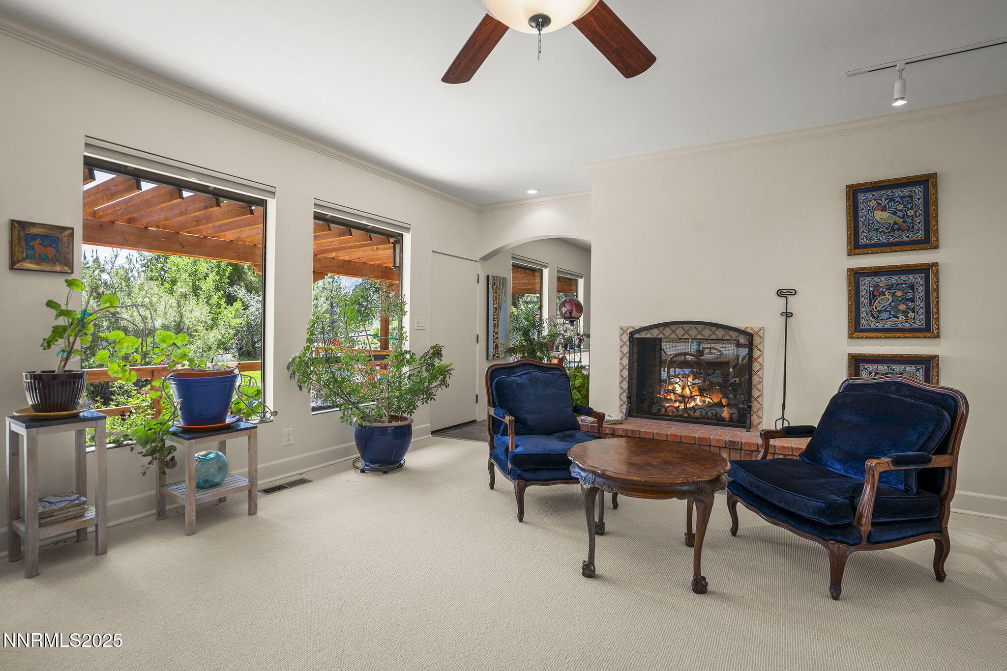 2548 Jacks Valley Road Genoa, NV 89411 - Photo 14 of 51 a living room with furniture and a fireplace