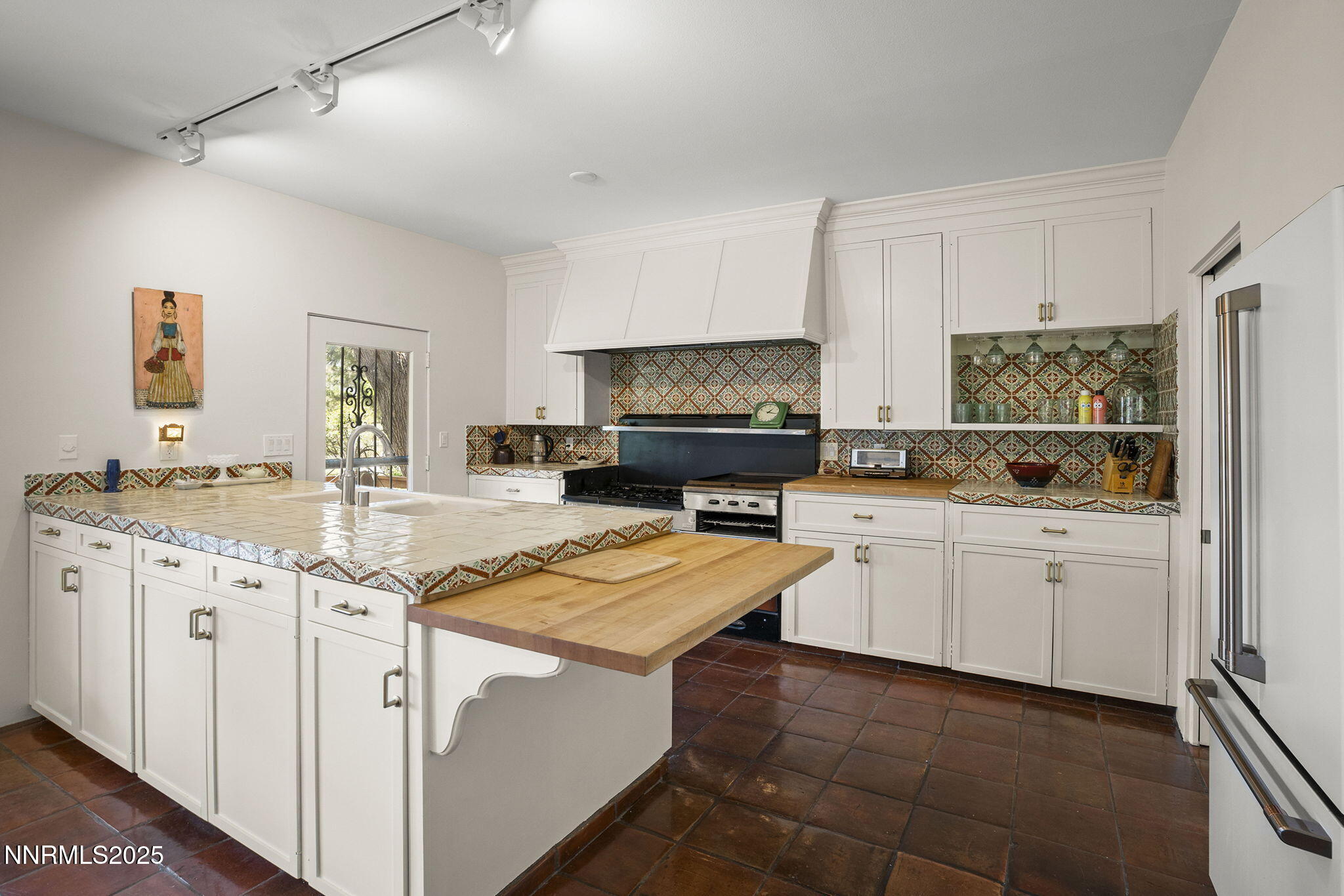 2548 Jacks Valley Road Genoa, NV 89411 - Photo 17 of 51 a kitchen with granite countertop appliances a sink and cabinets