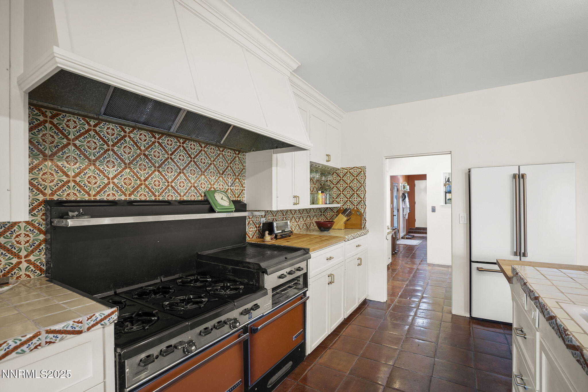 2548 Jacks Valley Road Genoa, NV 89411 - Photo 19 of 51 a kitchen with stainless steel appliances a stove and a refrigerator