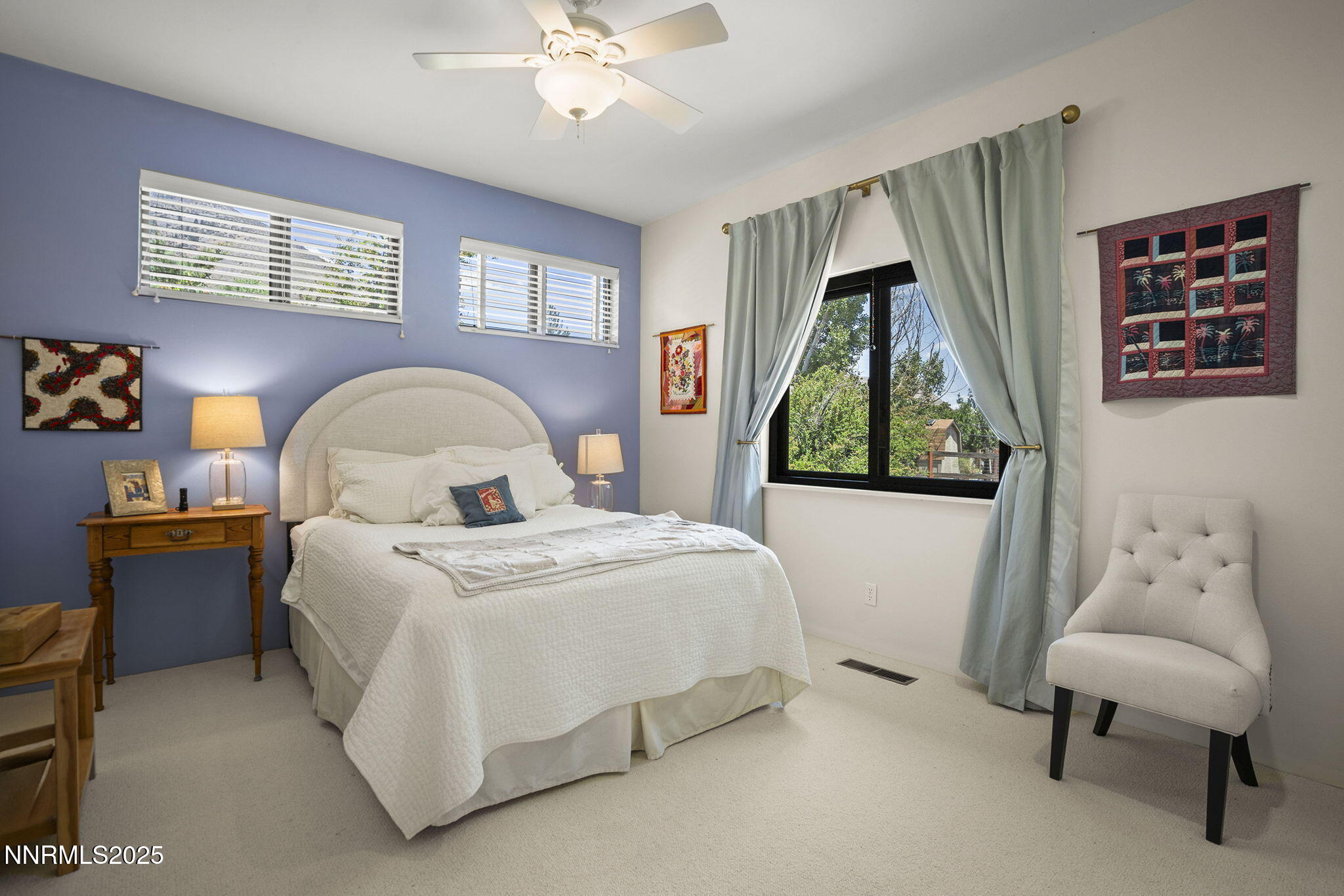 2548 Jacks Valley Road Genoa, NV 89411 - Photo 26 of 51 a bedroom with a bed and a couch