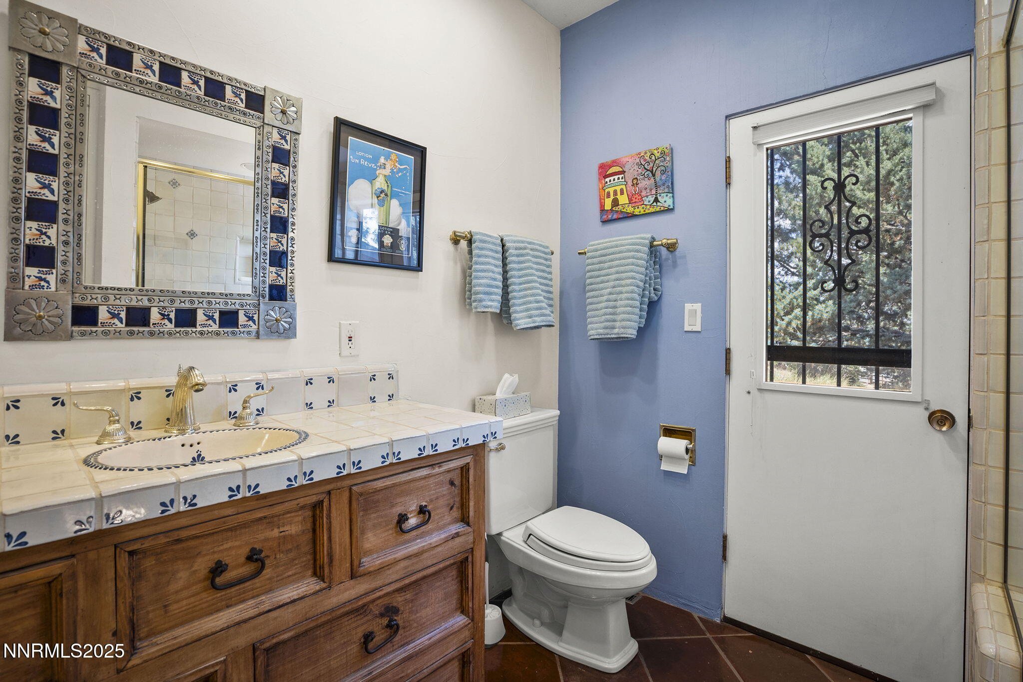 2548 Jacks Valley Road Genoa, NV 89411 - Photo 27 of 51 a bathroom with a granite countertop toilet sink and mirror