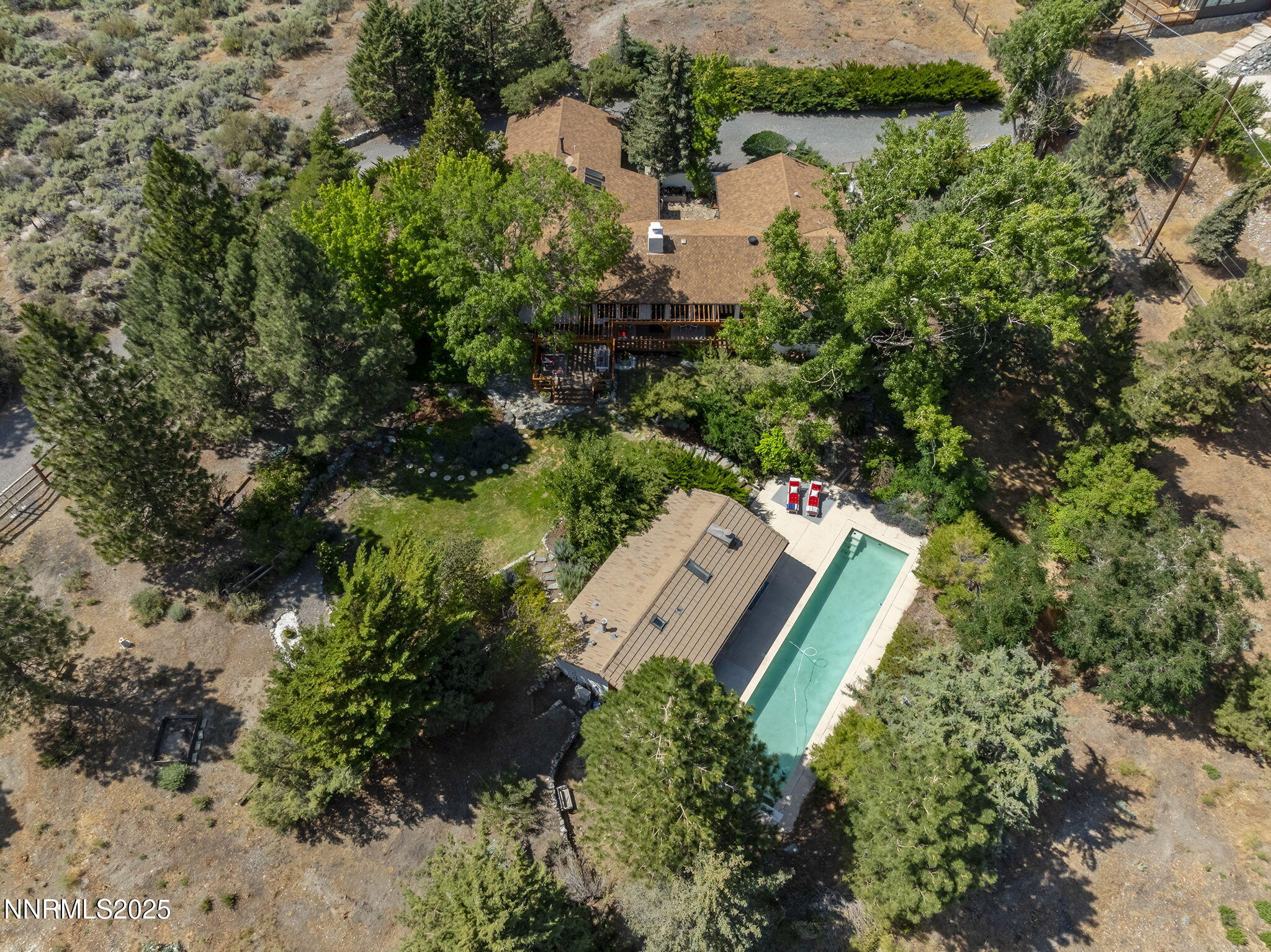 2548 Jacks Valley Road Genoa, NV 89411 - Photo 47 of 51 an aerial view of a house with a yard and lake view