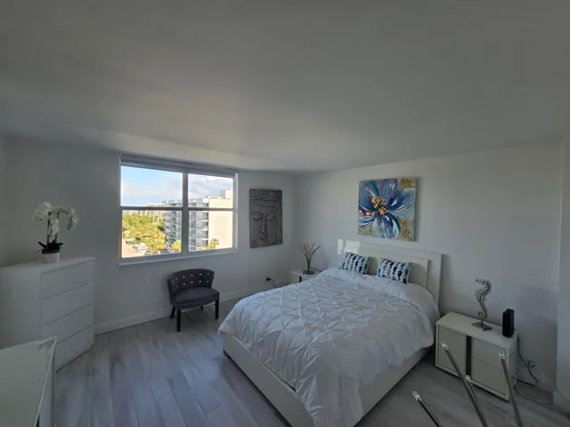 a bedroom with a bed and a table in it