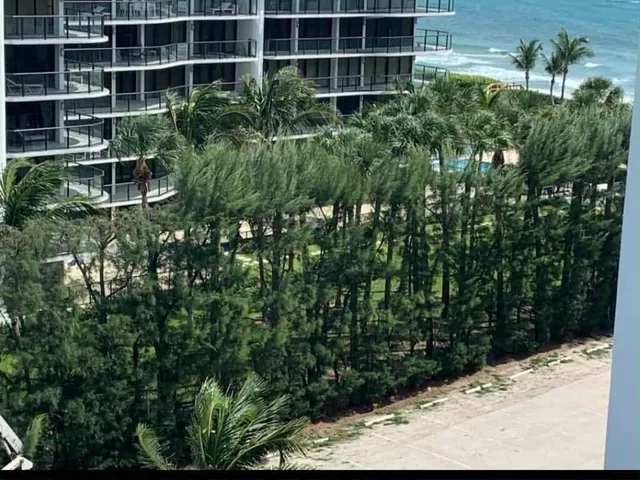 a view of a swimming pool and chairs in patio