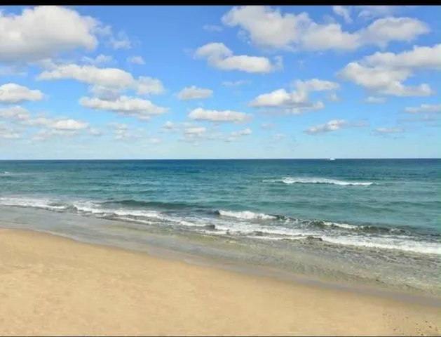 a kitchen with a stove top oven and cabinets