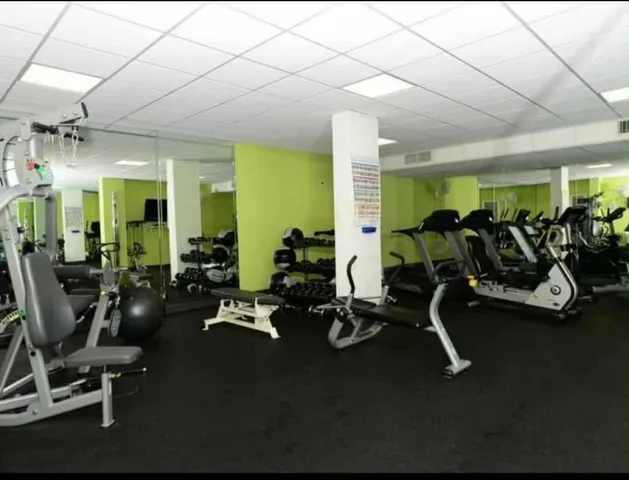 a view of a swimming pool and an outdoor seating