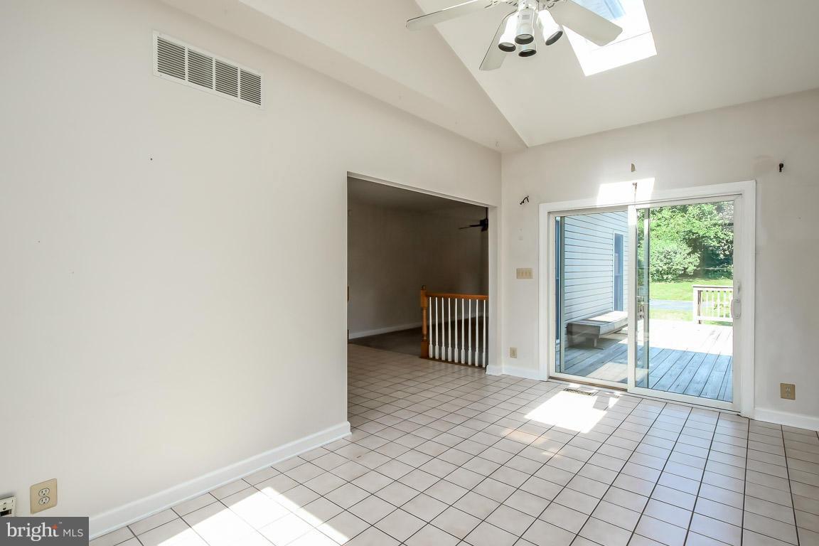 2510 Rocks Road Forest Hill, MD 21050 - Photo 14 of 30 a view of a big room with windows and chandelier fan