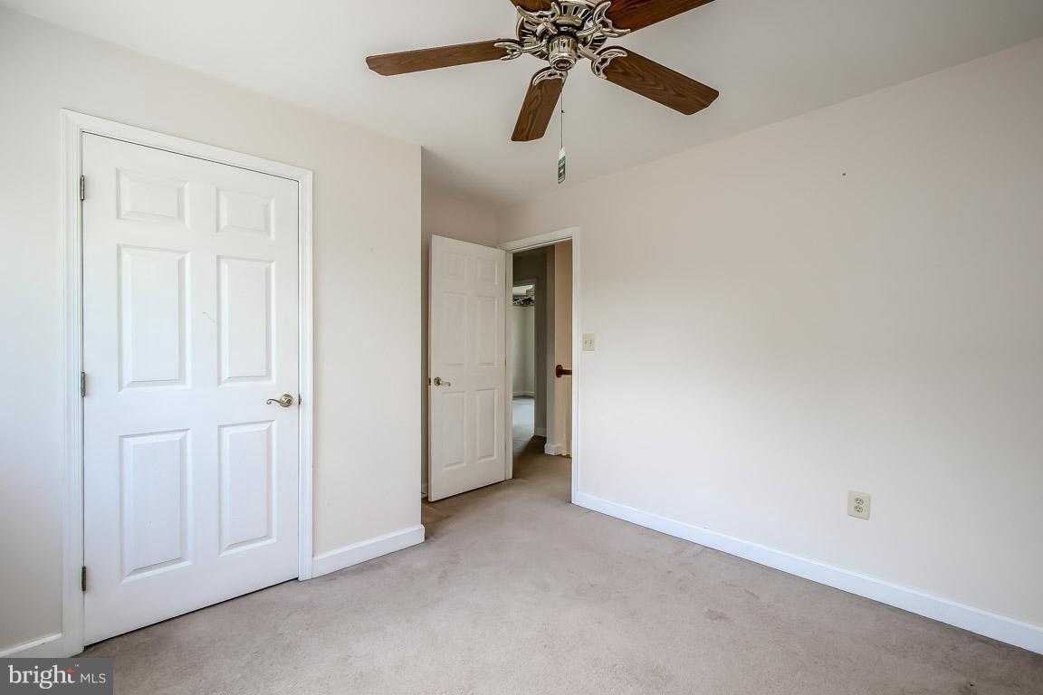 2510 Rocks Road Forest Hill, MD 21050 - Photo 22 of 30 an empty room with closet and a chandelier fan