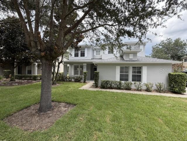 1885 Scrub Jay Road Apopka, FL 32703 - Photo 3 of 29 a front view of a house with a garden