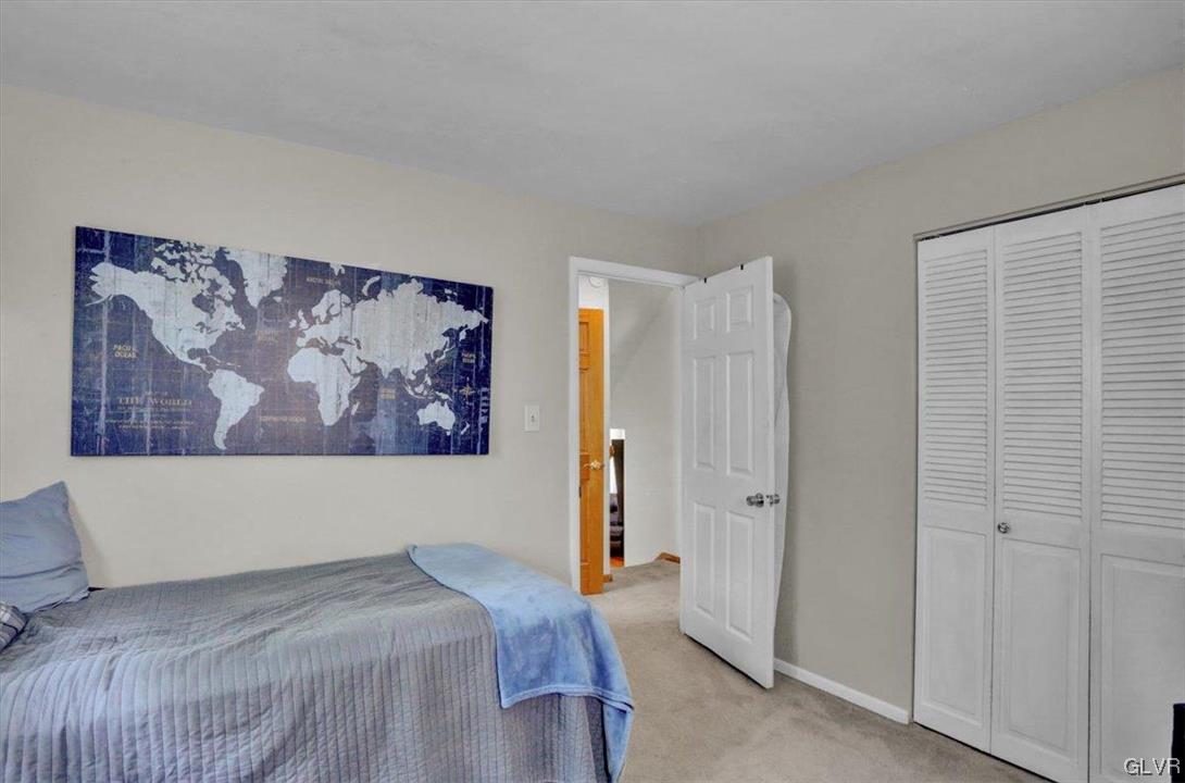 210 Rothermel Boulevard Reading, PA 19605 - Photo 20 of 26 a bedroom with a bed and a wall painting
