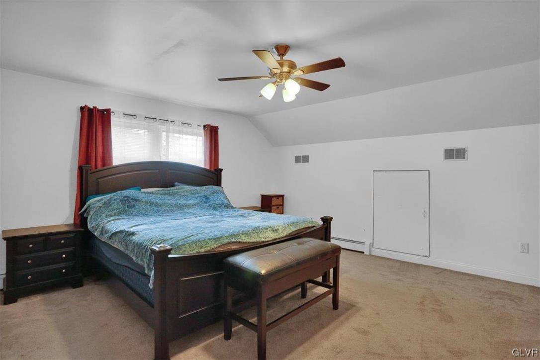 210 Rothermel Boulevard Reading, PA 19605 - Photo 22 of 26 a bedroom with a bed and a chandelier