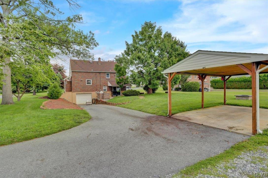 210 Rothermel Boulevard Reading, PA 19605 - Photo 6 of 26 a view of a house with backyard and a garden