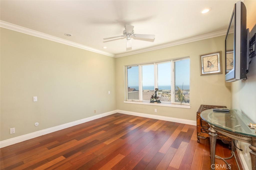 33571 Binnacle Drive Dana Point, CA 92629 - Photo 23 of 48 a view of an empty room with a window and wooden floor