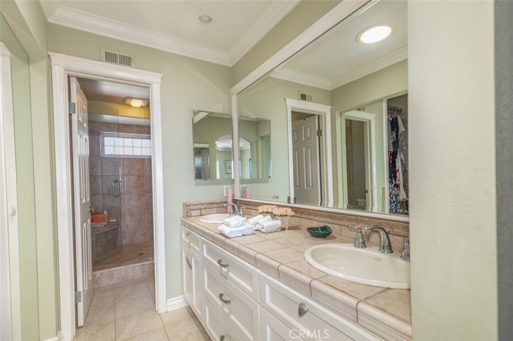 33571 Binnacle Drive Dana Point, CA 92629 - Photo 26 of 48 a bathroom with a granite countertop double vanity sink and a mirror