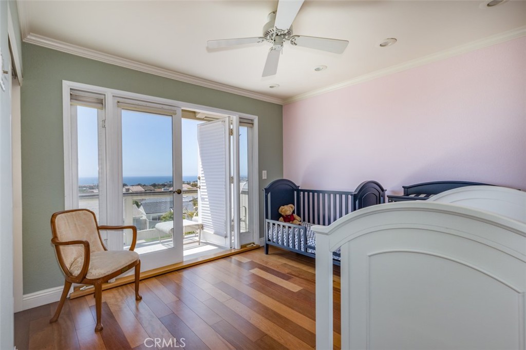 33571 Binnacle Drive Dana Point, CA 92629 - Photo 29 of 48 a bedroom with furniture and a wooden floor