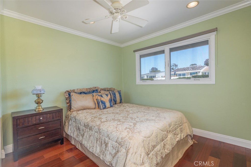 33571 Binnacle Drive Dana Point, CA 92629 - Photo 32 of 48 a bedroom with a large bed and a chandelier