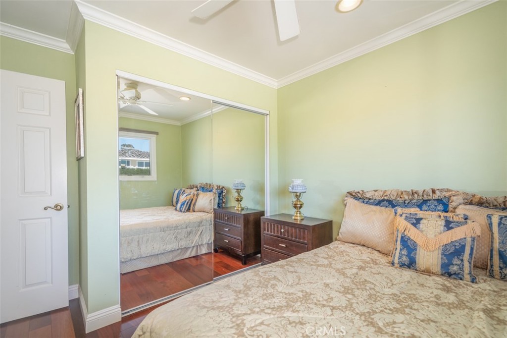 33571 Binnacle Drive Dana Point, CA 92629 - Photo 33 of 48 a bedroom with a bed and wooden floor