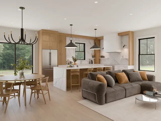 a living room with furniture a large window and a chandelier