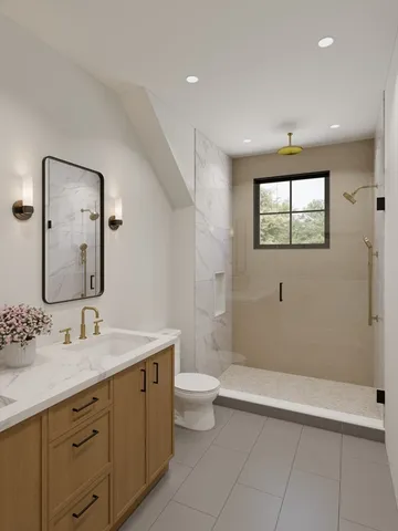 a bathroom with a double vanity sink toilet and shower