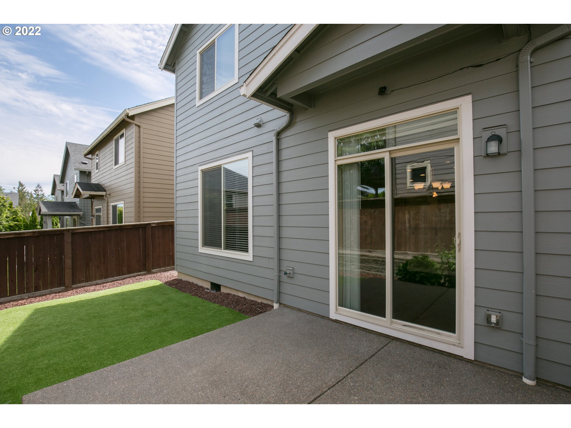 4106 North 5th Way Ridgefield, WA 98642 - Photo 25 of 26 a backyard of a house with lots of green space