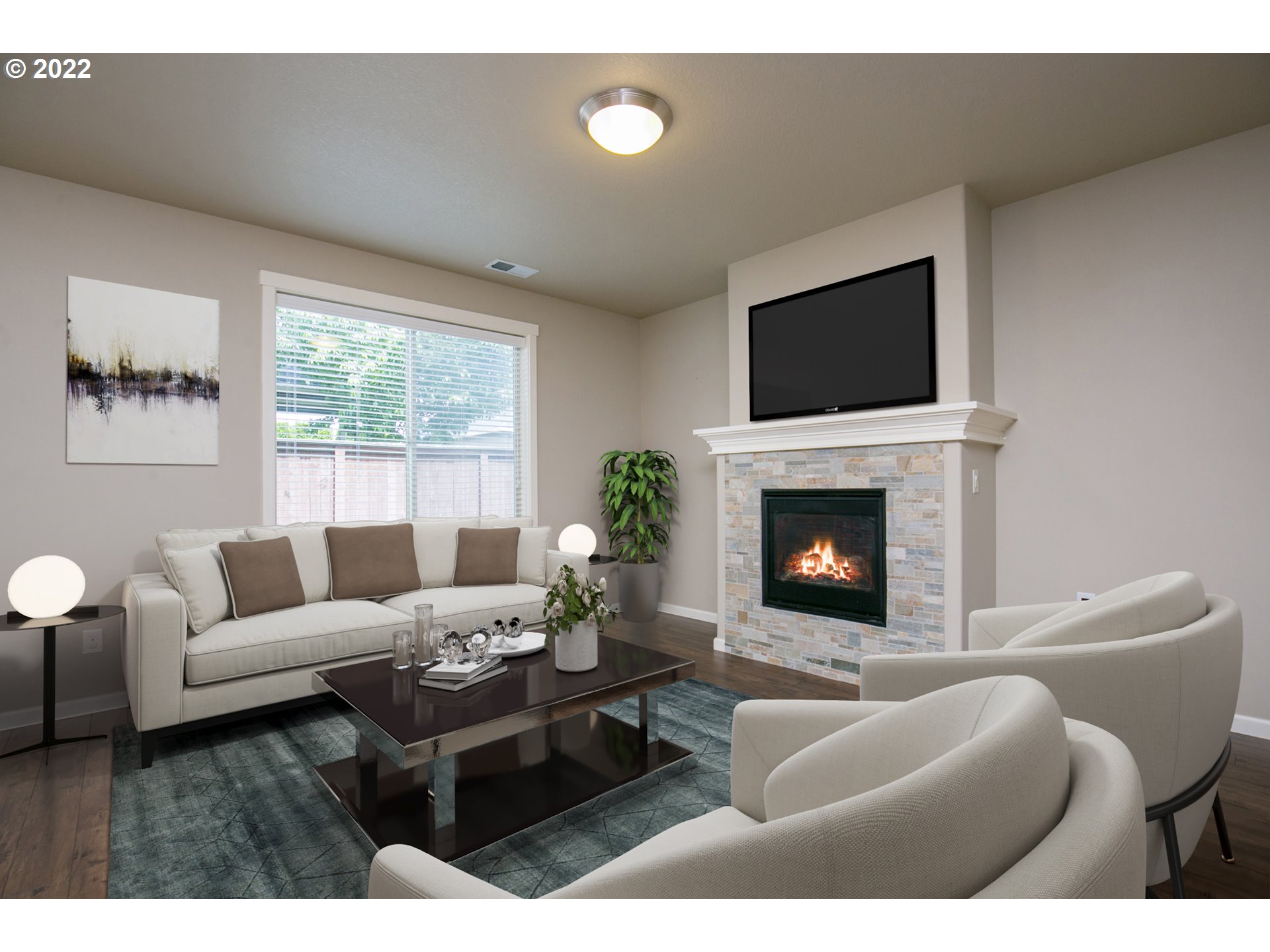 4106 North 5th Way Ridgefield, WA 98642 - Photo 3 of 26 a living room with furniture a fireplace and a flat screen tv