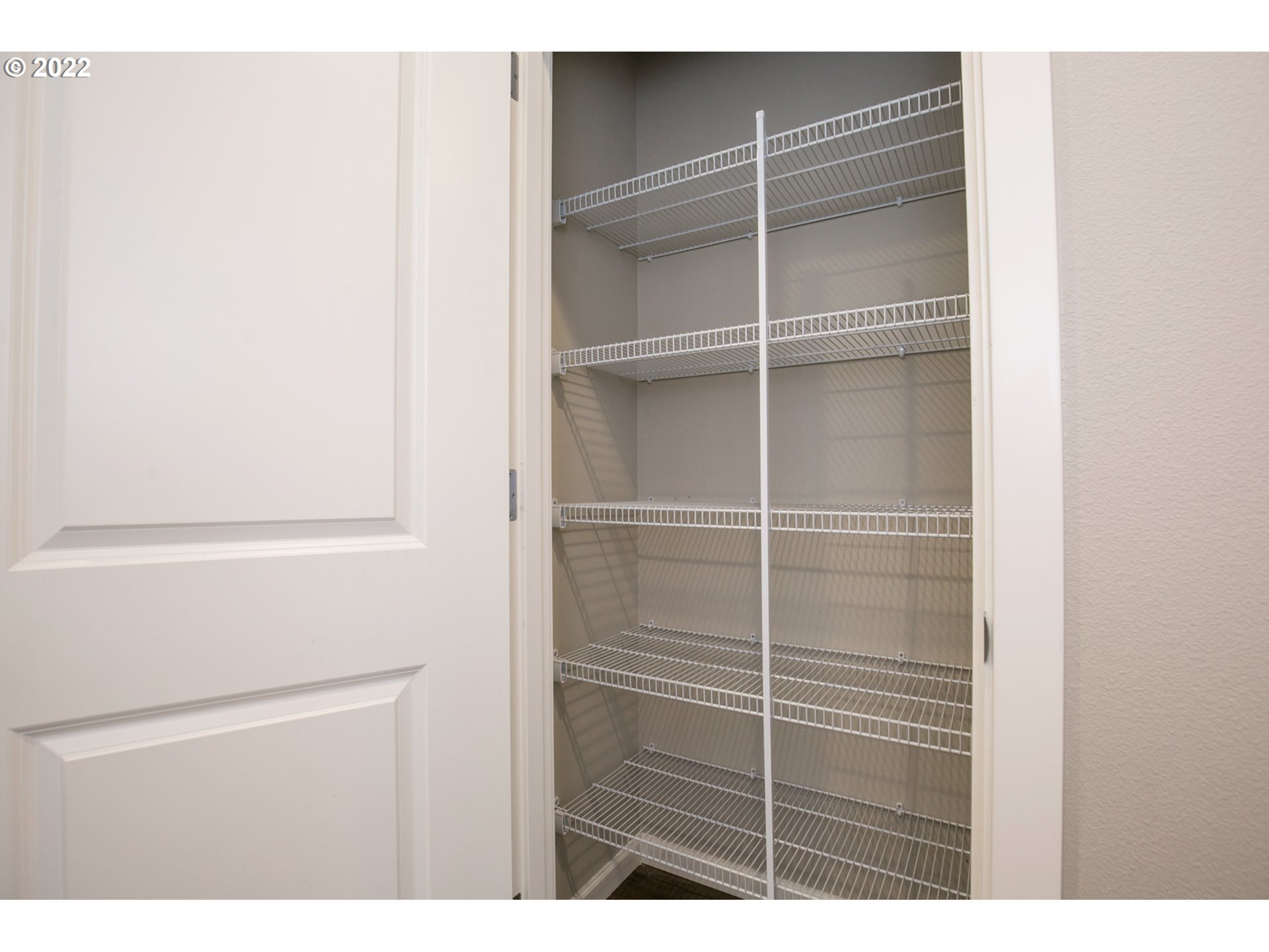 4106 North 5th Way Ridgefield, WA 98642 - Photo 8 of 26 a view of closet area with empty racks