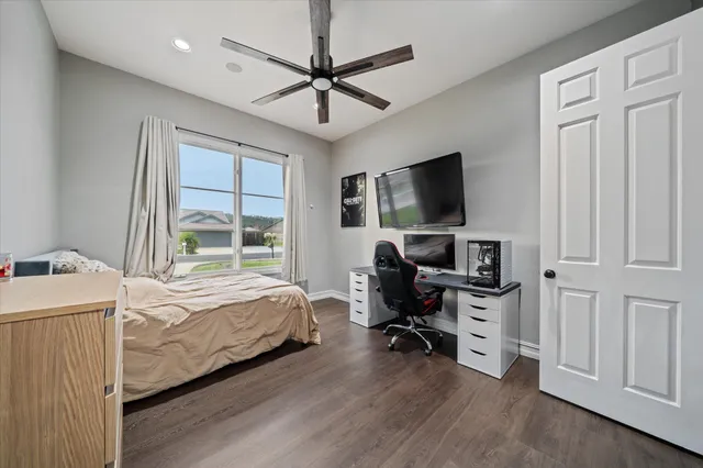 a bathroom with a sink toilet and mirror