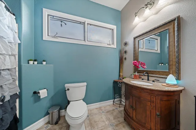 a bedroom with furniture and a chandelier