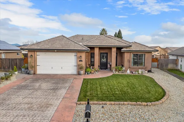 an aerial view of a house with a swimming pool