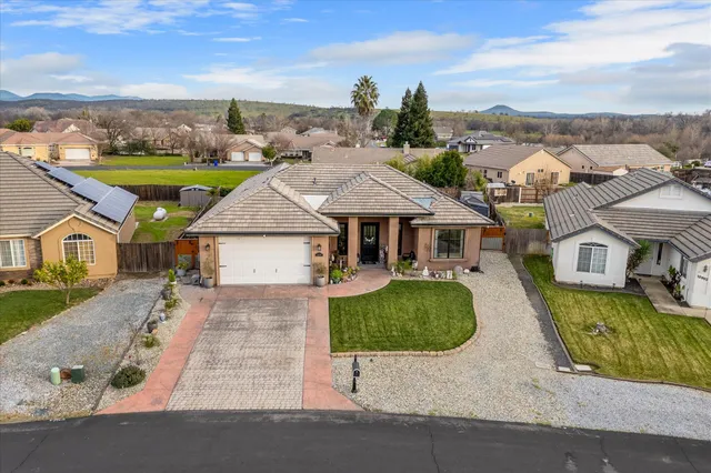 an aerial view of a house with outdoor space