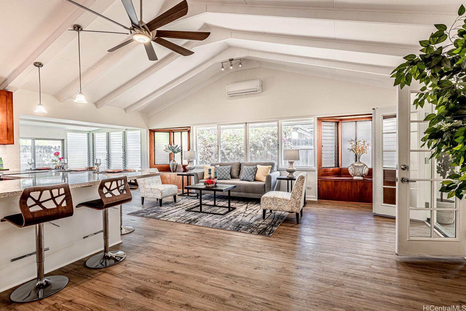 128 Kuliouou Road Honolulu, HI 96821 - Photo 1 of 1 a living room with furniture and a large window