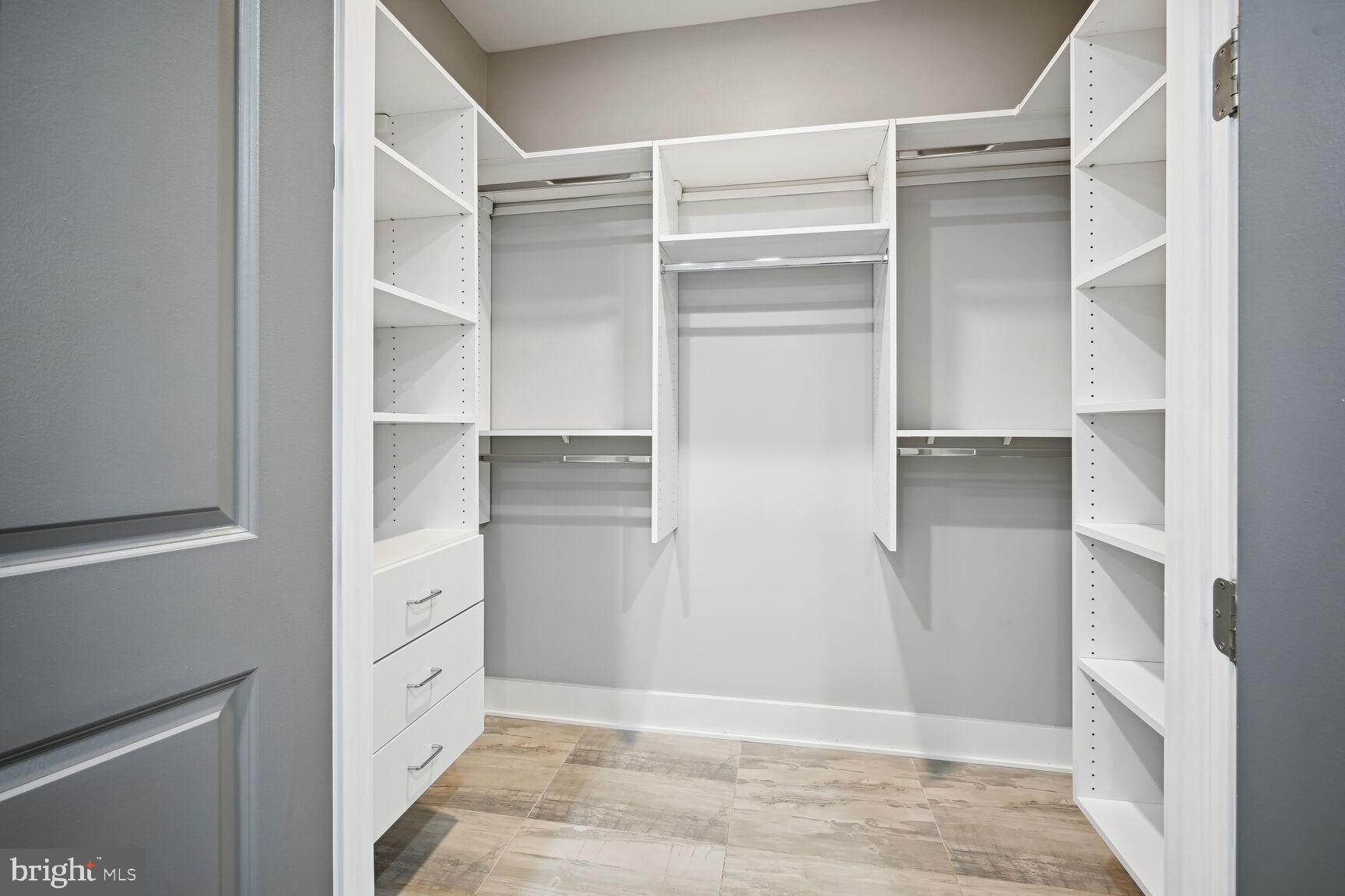 1143 5th Street Northeast, Unit 1 Washington, DC 20002 - Photo 19 of 54 a view of walk in closet with empty racks