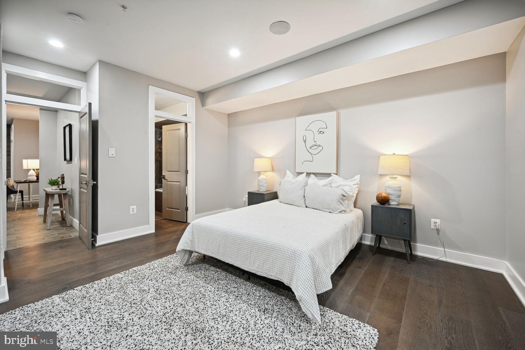 1143 5th Street Northeast, Unit 1 Washington, DC 20002 - Photo 22 of 54 a spacious bedroom with a bed and wooden floor