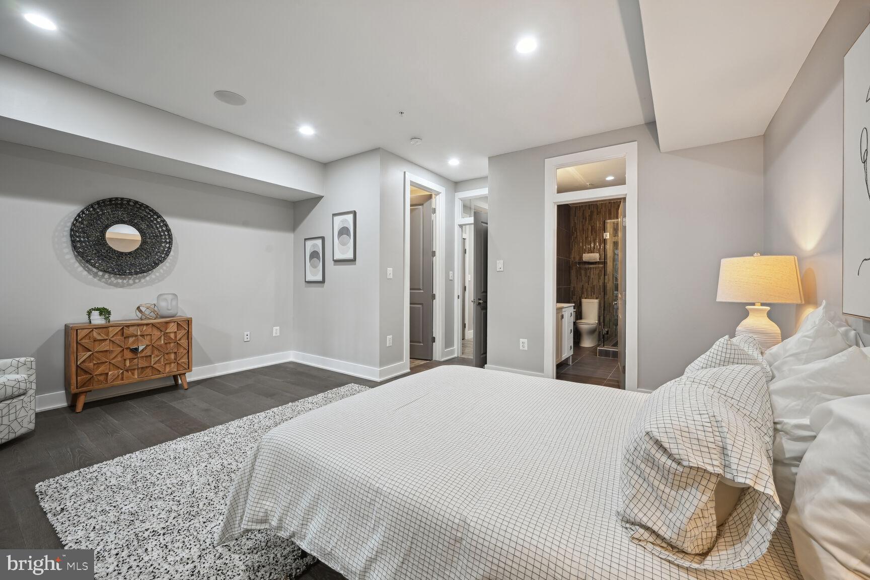 1143 5th Street Northeast, Unit 1 Washington, DC 20002 - Photo 23 of 54 a bedroom with a bed and dresser