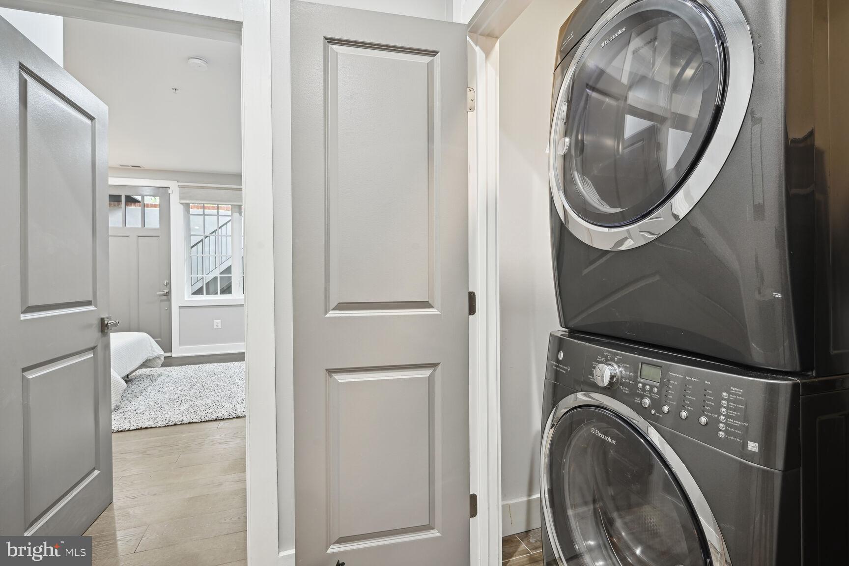 1143 5th Street Northeast, Unit 1 Washington, DC 20002 - Photo 28 of 54 a view of a storage and utility room with washer and dryer