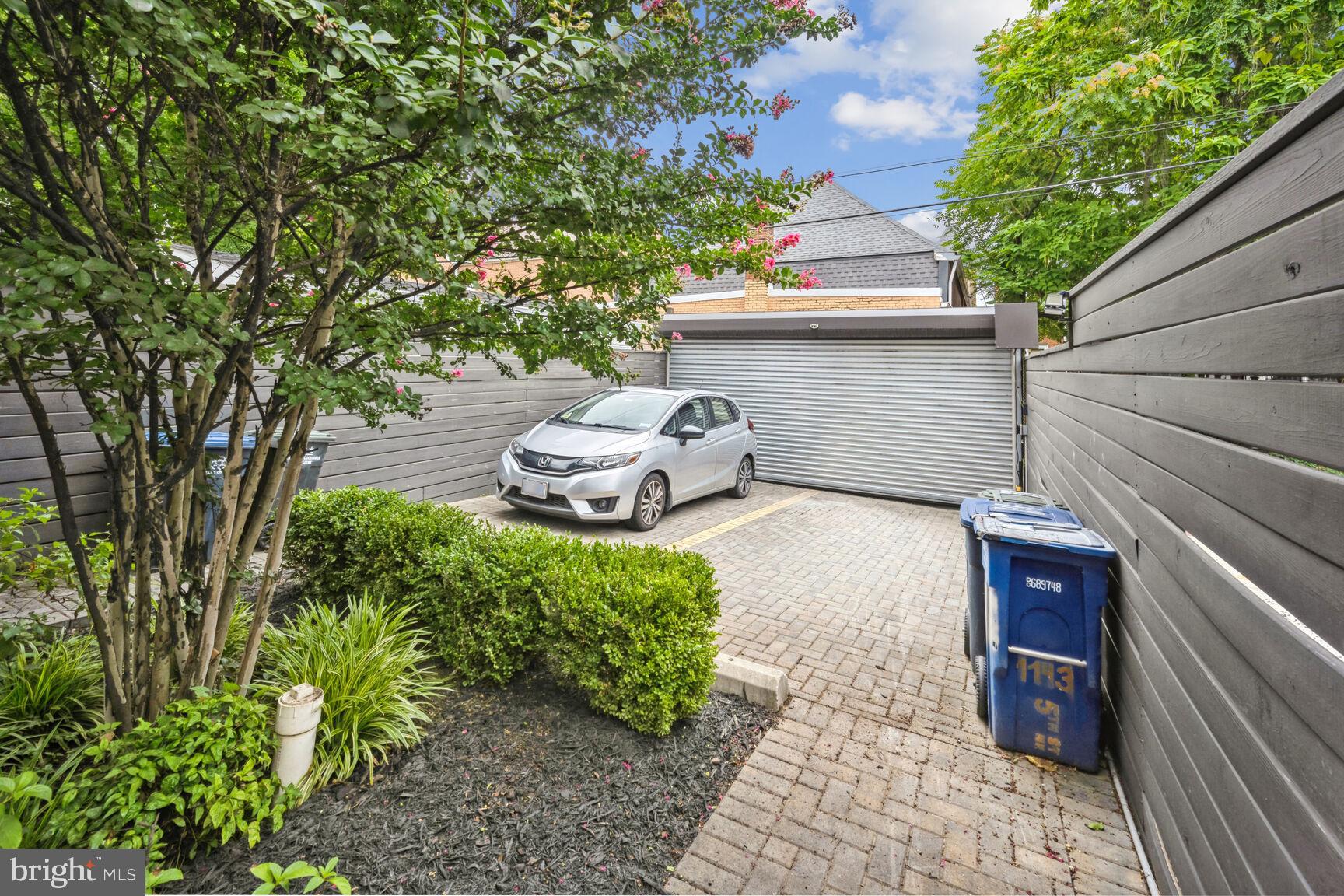 1143 5th Street Northeast, Unit 1 Washington, DC 20002 - Photo 29 of 54 a front view of a house with garden