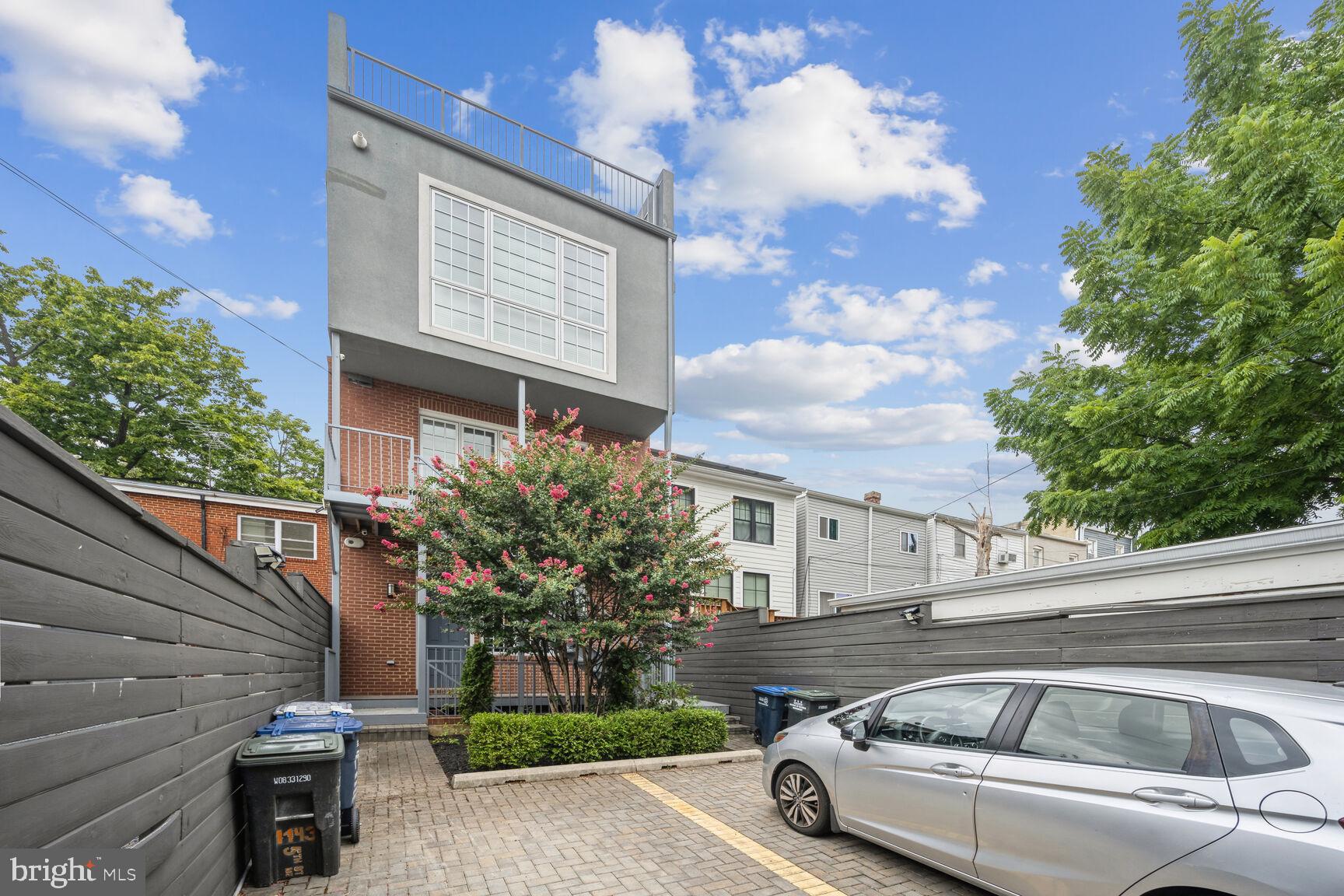 1143 5th Street Northeast, Unit 1 Washington, DC 20002 - Photo 32 of 54 a front view of a house with garden
