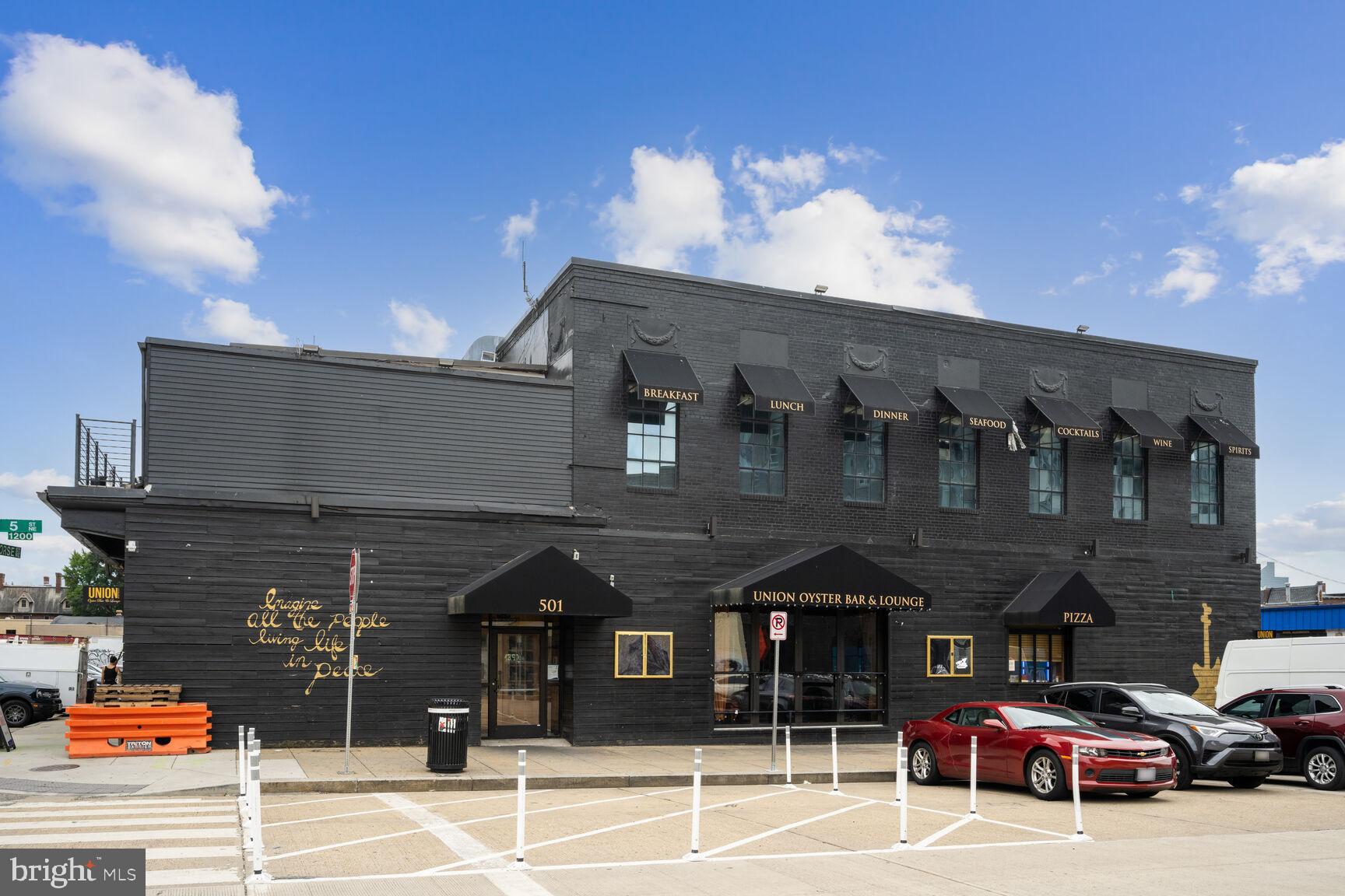 1143 5th Street Northeast, Unit 1 Washington, DC 20002 - Photo 48 of 54 a front view of a building with parking space
